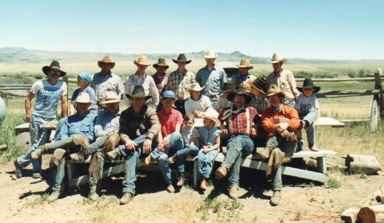 Ray, seated 3rd from left, with his cowboy crew, kids, and cook (top left)